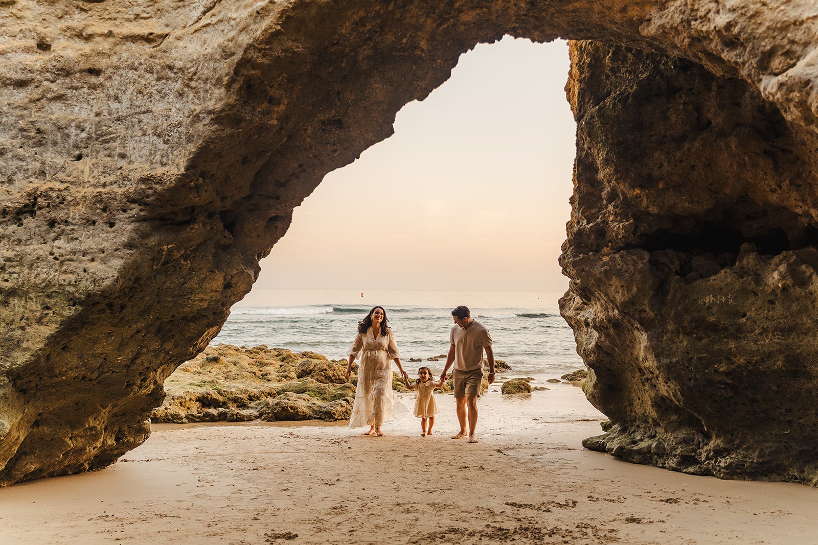 Club Med de Balaia Beach - Praia Maria Luisa at sunset with secret caves and arches at golden hour sunset family photography 