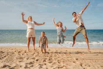 Algarve family photographer Family playing on the beach in Algarve