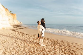 Lagos beach surprise proposal, engagement and proposal photographer in Algarve. couple kissing at sunset Lagos beach surprise proposal, engagement and proposal photographer in Algarve. couple kissing at sunset