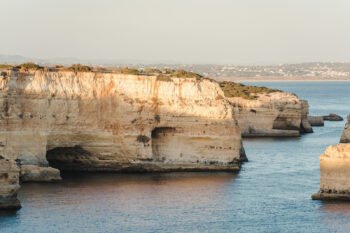 Surprise proposal photographer in Algarve, Praia Marinha beach. Engagement photography sessions in Algarve Portugal.