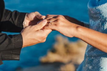 Vila Alba surprise proposal, Clifftop Surprise proposal photographer in Algarve. Hands with engagement diamond ring